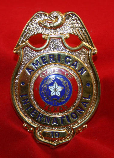 OBSOLETE USA AMERICAN INTERNATIONAL Texas Badge