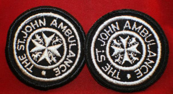 The St John Ambulance Uniform / Cap Badge Patch. Lot of 2.